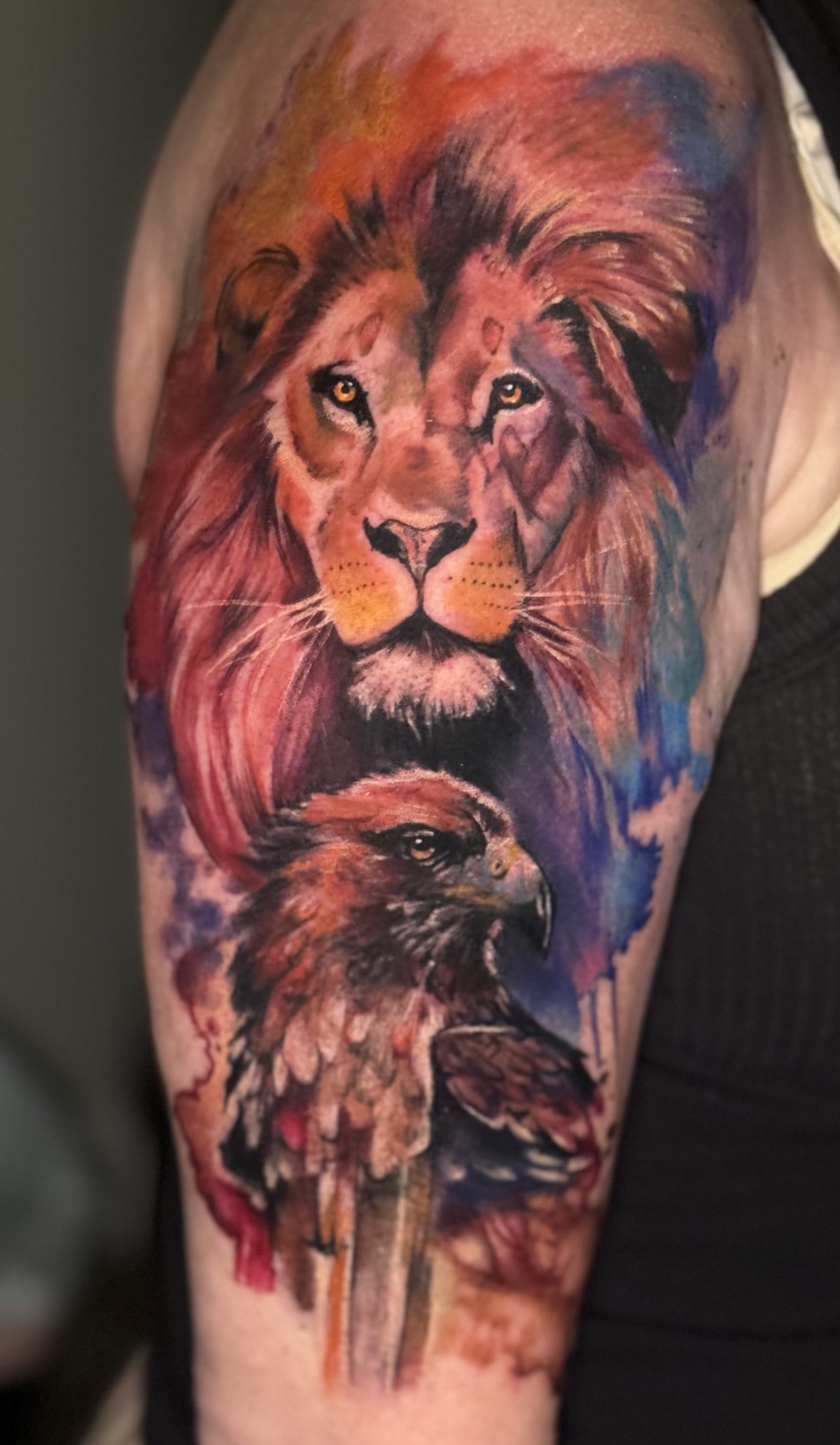 Color realism lion and eagle tattoo